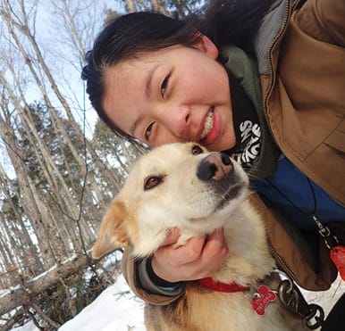 Maddie with one of the dog sledding huskies