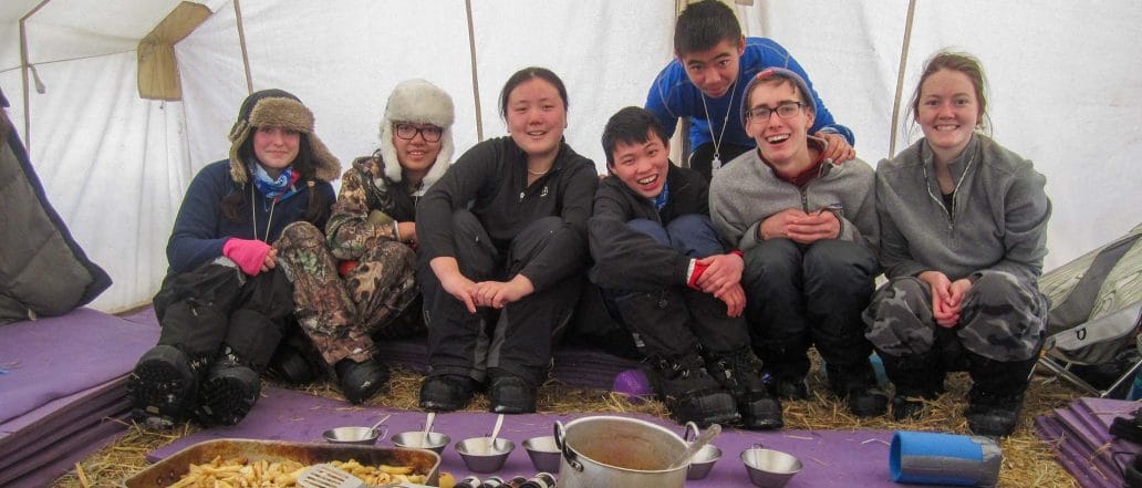 Image of a group of people in a tent