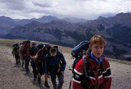 7 teens hiking up a mountain
