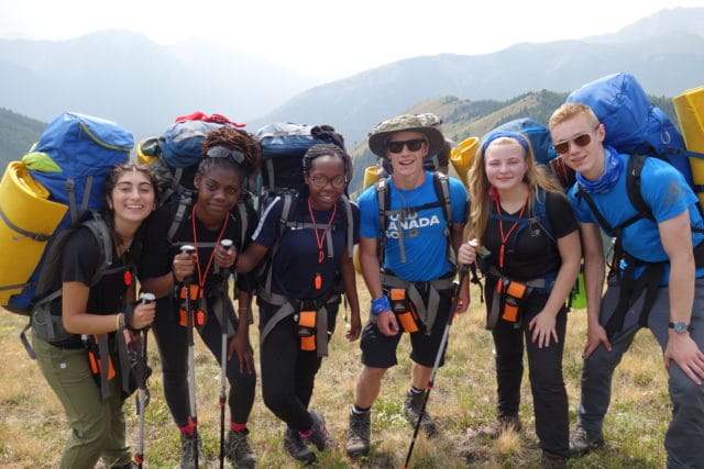 hiking students smiling at camera