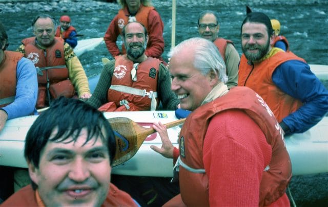 men in boat smiling at camera