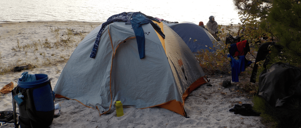 Image of tents on the shore