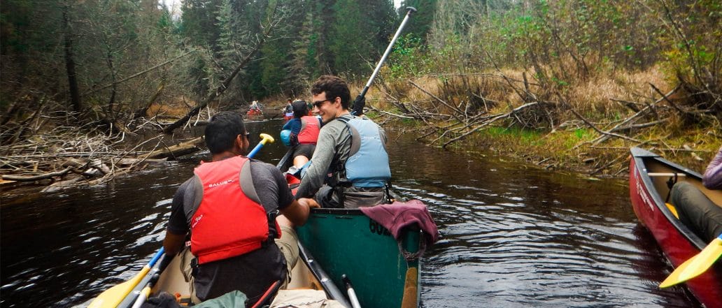Image of a group canoeing together