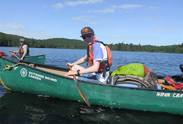 Image of a boy in a canoe