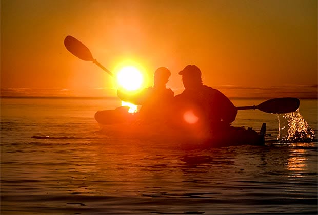 Imag of 2 kayakers at sunset