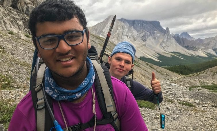 2 hikers smiling