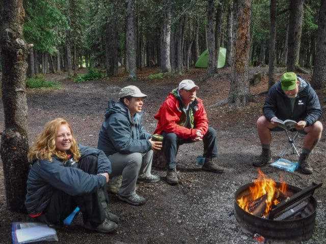 A group of people around a campfire