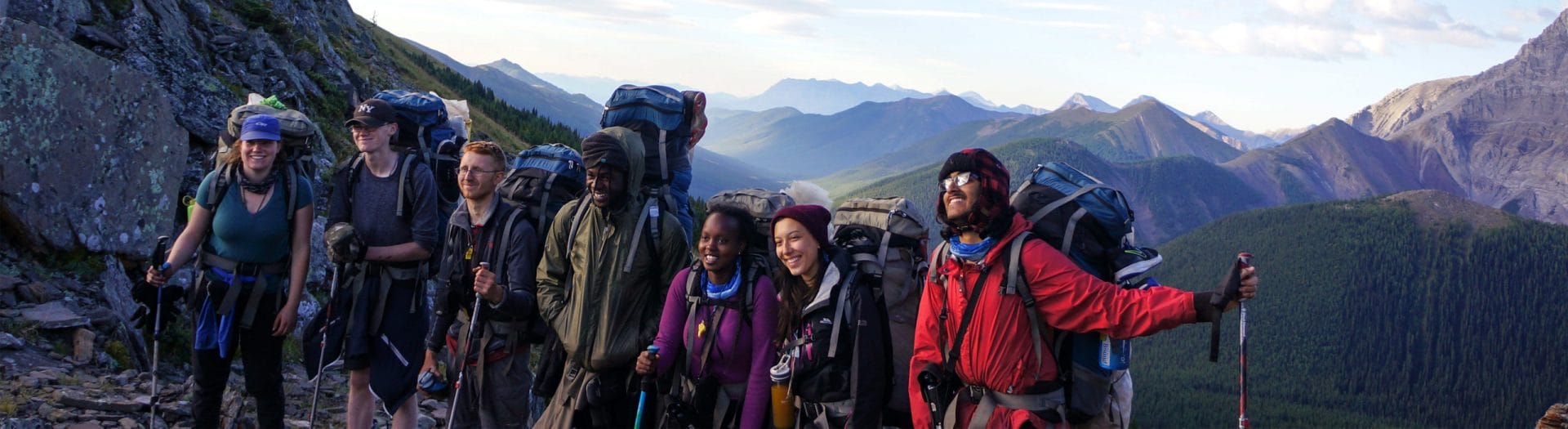 Image of a group of hikers in front of a mountian range