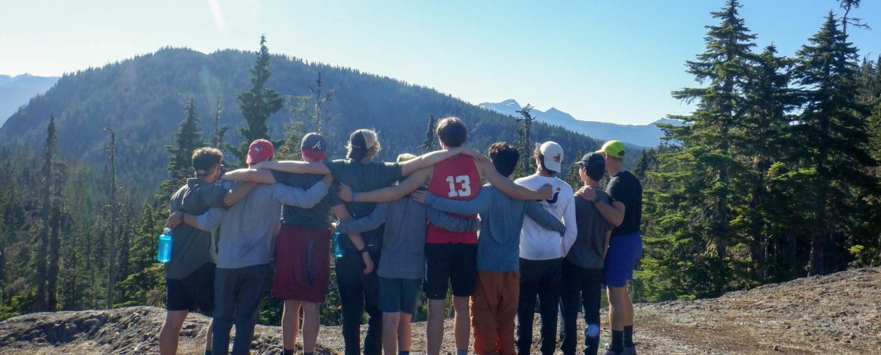 Image of 10 teens with their arms around each other