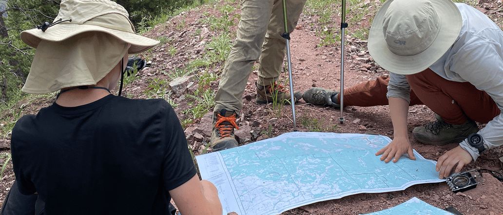 Image of hikers looking at map