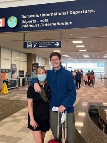 Janet MacDonald and her son at the airport in July 2022 when he was about to go on his Outward Bound Canada adventure