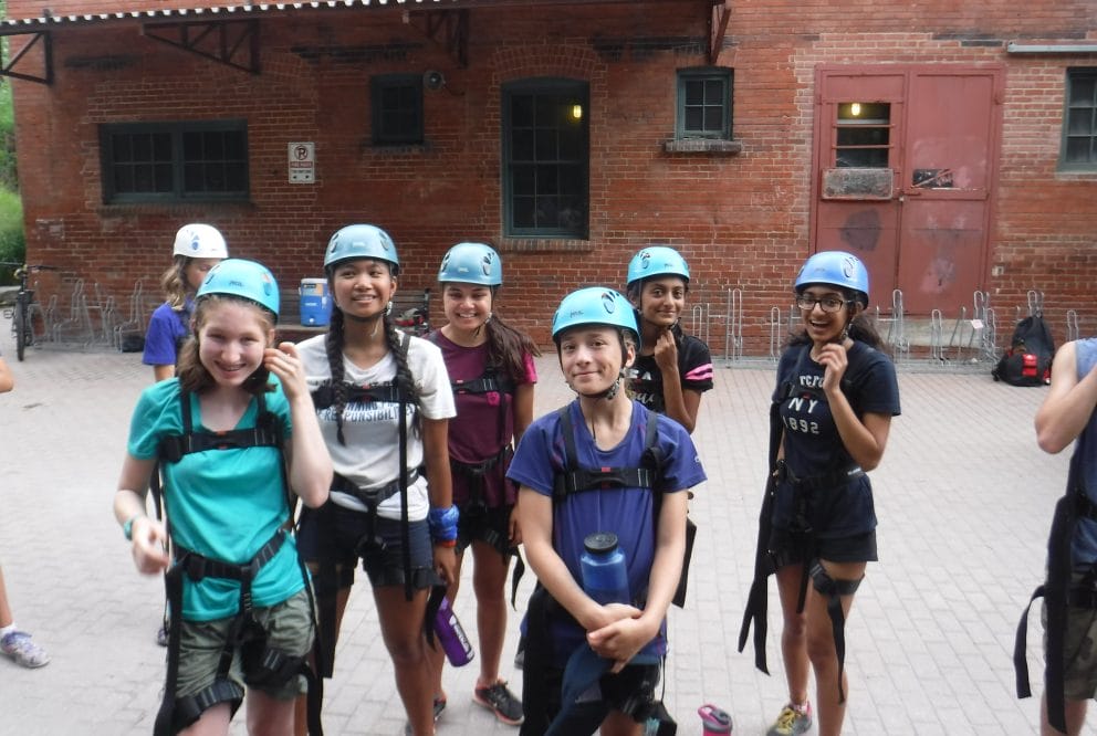 teens smiling in ropes gear