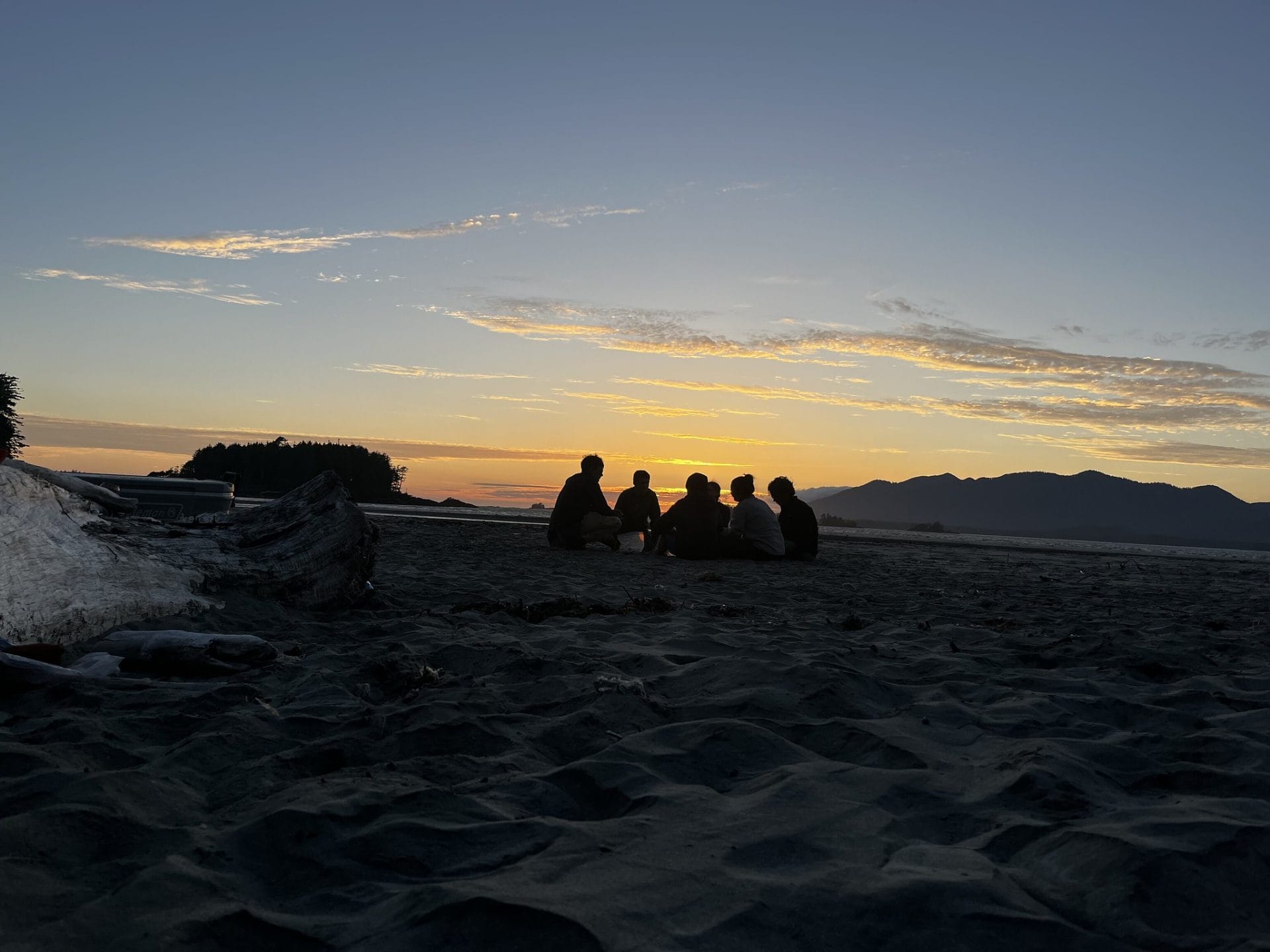 photo of teens in the sunset on a beach