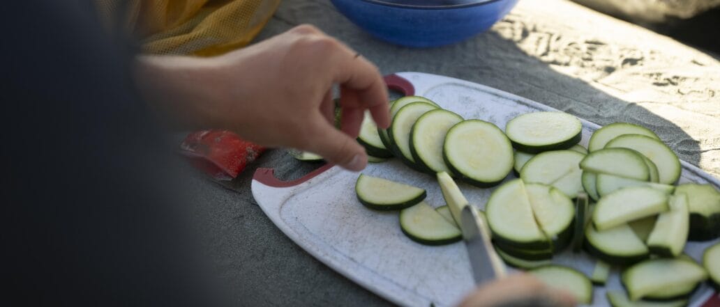 Image of someone chopping cucumber